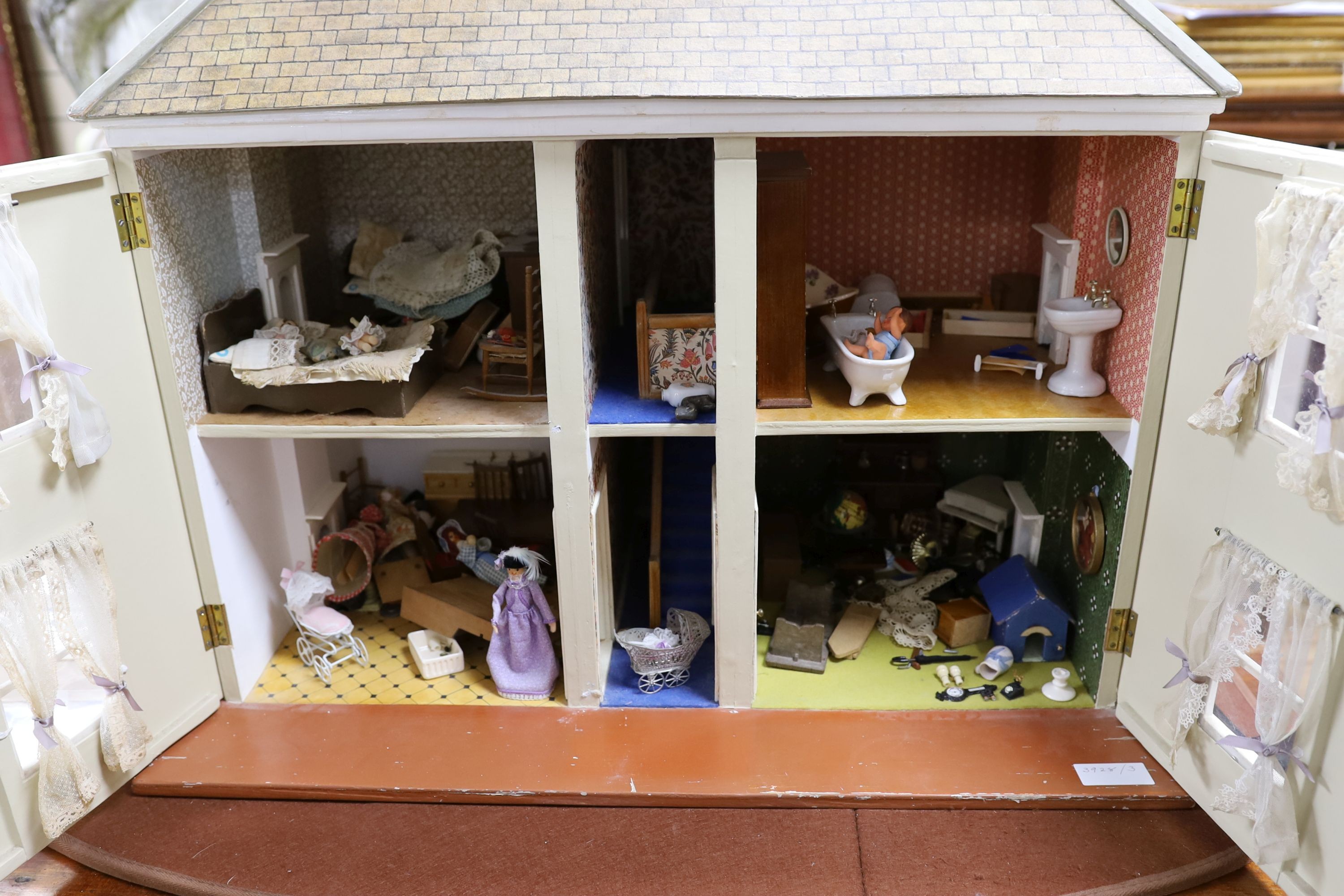 A dolls house, length 74cm, depth 39cm, height 66cm